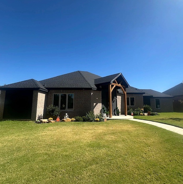 Modern residential roof with dark shingles